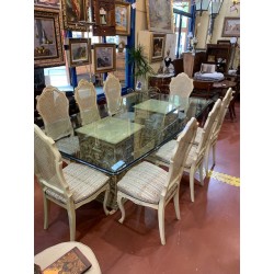 Mesa comedor 2 columnas con relieves tapa cristal con forma